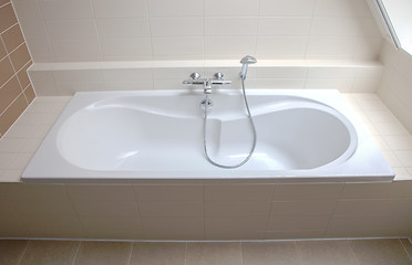 Image showing Bathtub in a tiled bathroom