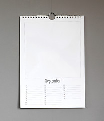 Image showing Simple old birthday calendar hanging on a grey wall - September