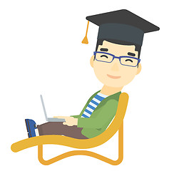 Image showing Graduate lying on chaise lounge with laptop.