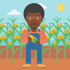 Image showing Farmer holding corn.