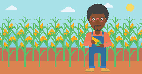 Image showing Farmer holding corn.