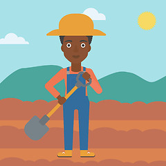 Image showing Farmer on the field with shovel.