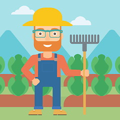 Image showing Farmer with rake.