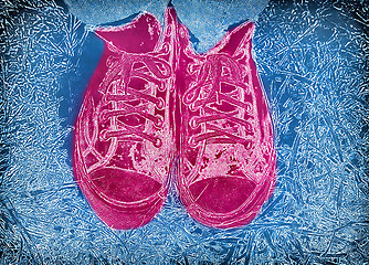 Image showing Blue background with feet in pink bright sneakers 