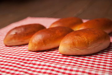 Image showing Pies of puff pastry close up on an table. 