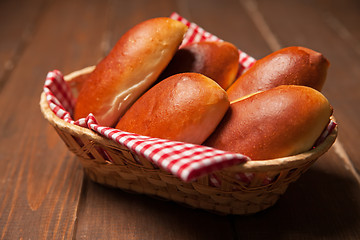 Image showing Pies of puff pastry close up in a basket. 