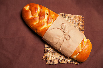 Image showing Poppy roll on brown napkin