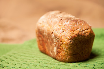 Image showing Loaf of grey wheat rye bread on napkin