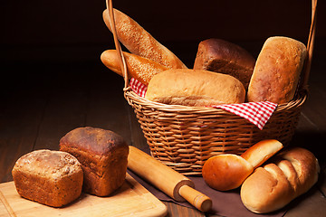 Image showing Composition with bread, cutting board and rolling-pin