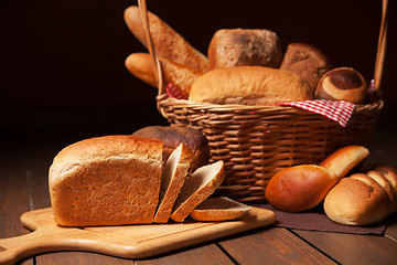 Image showing Composition with bread and rolls in wicker basket