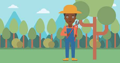 Image showing Farmer with pruner in garden.