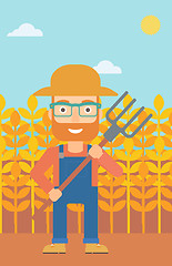 Image showing Farmer with pitchfork.