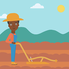 Image showing Farmer on the field with plough.