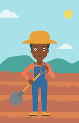 Image showing Farmer on the field with shovel.