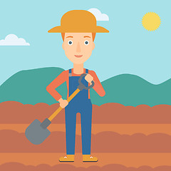 Image showing Farmer on the field with shovel.