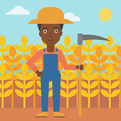 Image showing Farmer on the field with scythe.