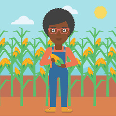 Image showing Farmer holding corn.