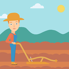 Image showing Farmer on the field with plough.