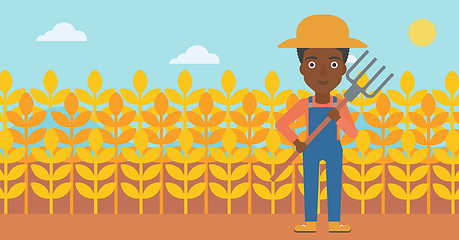 Image showing Farmer with pitchfork.