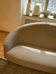 Image showing Elegant sofa in a room decorated with ceramic artwork