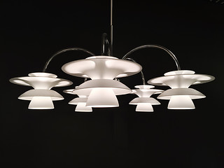 Image showing Beautiful white chandelier on dark background