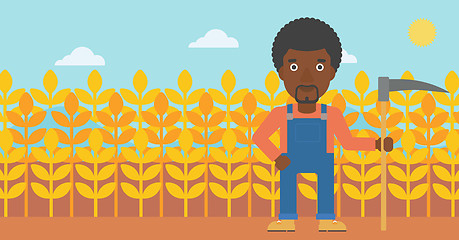 Image showing Farmer on the field with scythe.