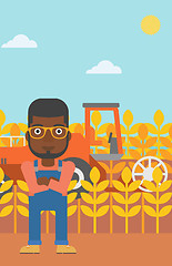 Image showing Man standing with combine on background.