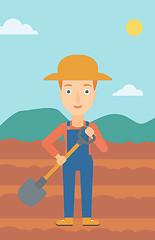 Image showing Farmer on the field with shovel.