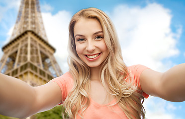 Image showing happy smiling young woman taking selfie