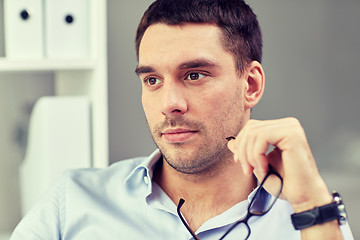 Image showing portrait of businessman with eyeglasses at office