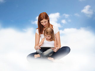 Image showing happy mother and little girl with tablet pc