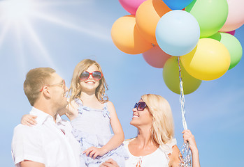 Image showing family with colorful balloons