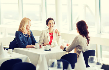 Image showing women drinking coffee and talking at restaurant