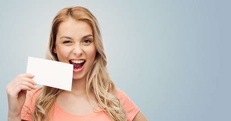 Image showing happy woman or teen girl with blank white paper