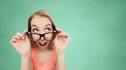 Image showing happy young woman or teenage girl in eyeglasses