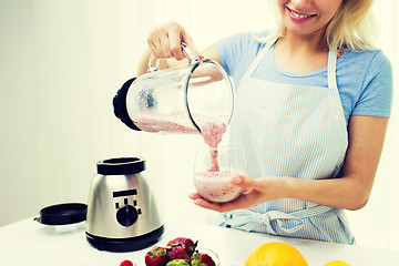 Image showing close up of woman with blender and shake at home