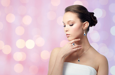 Image showing beautiful woman with earring, ring and pendant