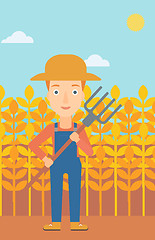 Image showing Farmer with pitchfork.