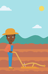 Image showing Farmer on the field with plough.