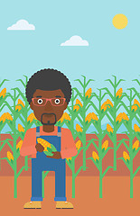 Image showing Farmer holding corn.