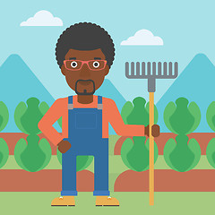 Image showing Farmer with rake.