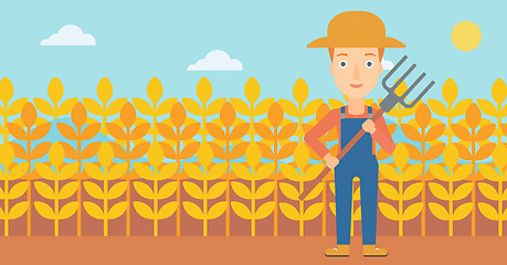 Image showing Farmer with pitchfork.