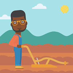 Image showing Farmer on the field with plough.