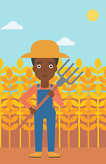 Image showing Farmer with pitchfork.