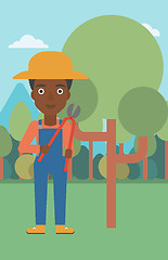 Image showing Farmer with pruner in garden.