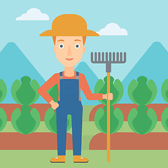 Image showing Farmer with rake.