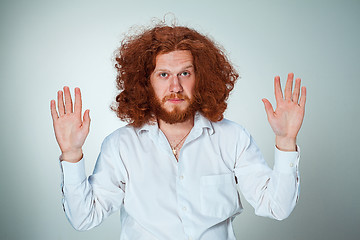 Image showing The young surrendered man looking at camera