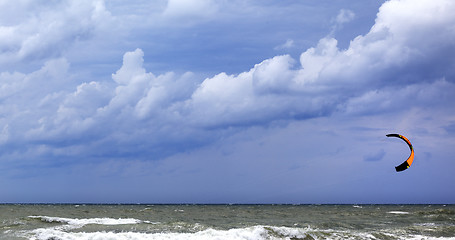 Image showing Power kite in sea and cloudy dark sky