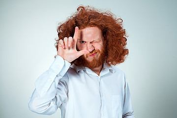 Image showing The young man looking at camera