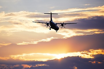 Image showing Airplane at the sunset 